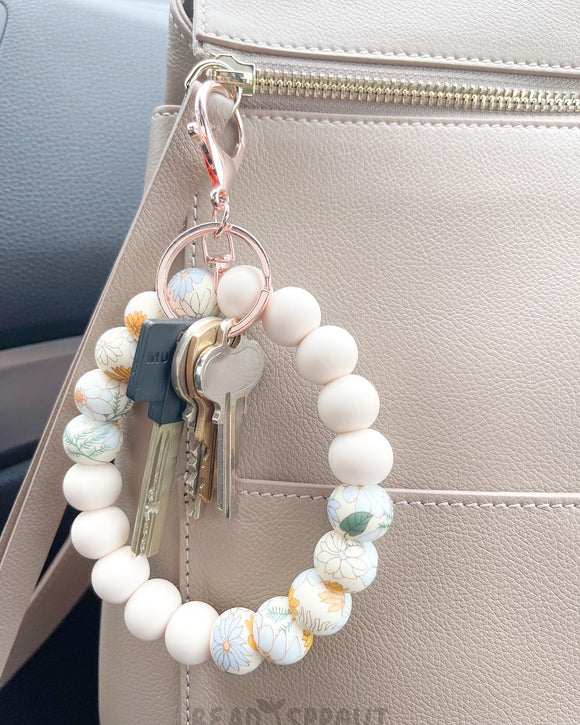 Boho floral wristley keychain, beaded silicone wristlet keycahin. Boho floral & cream colored