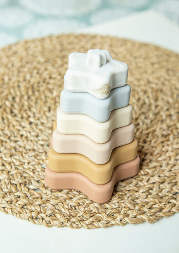 Star Shaped baby stacking toys in neutral color. 6 pcs of baby stacking toy. Made out of 100% pure silicone. Non toxic baby toy. It is safe for babies to chew on due to its material.