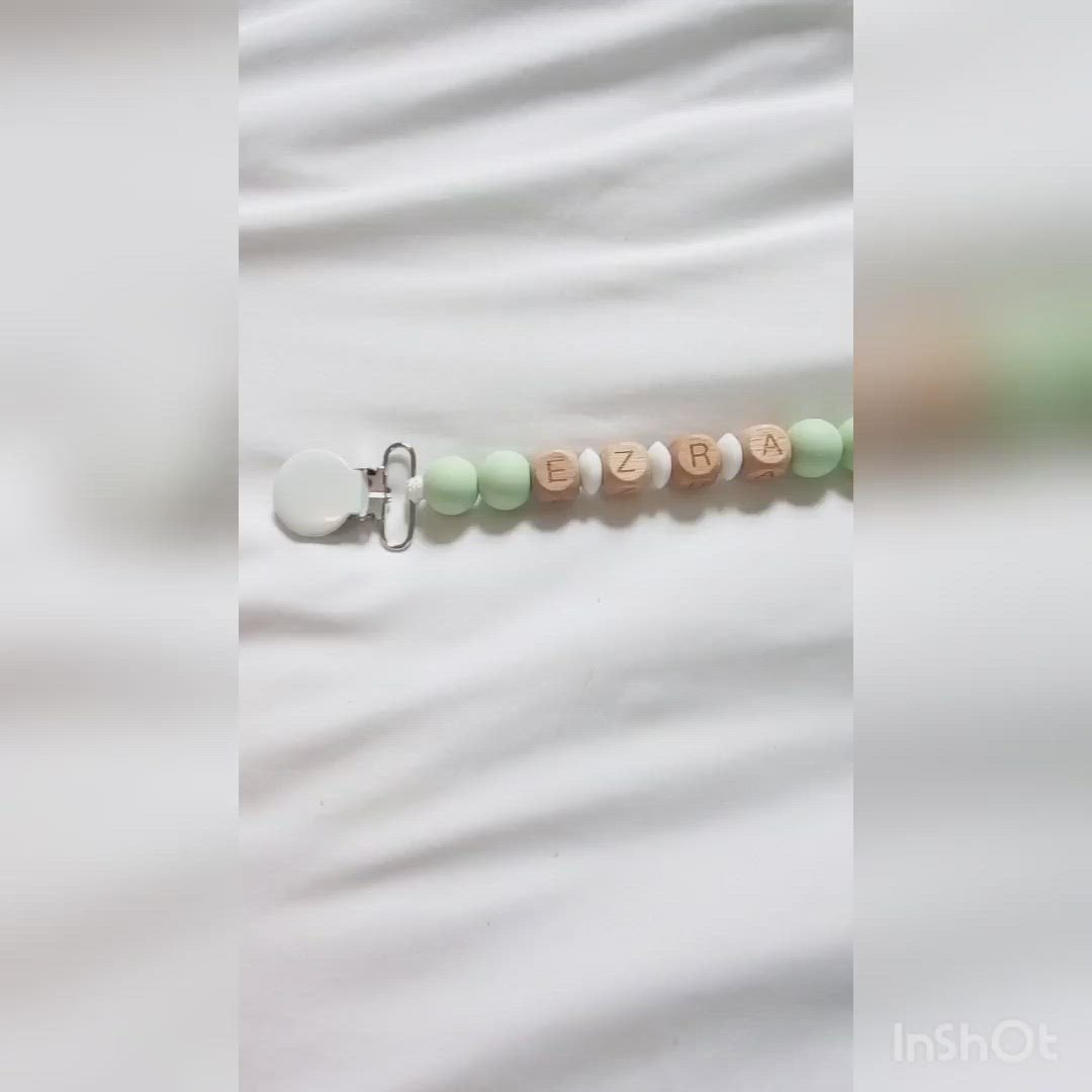 Personalized Pacifier clip, video showing pastel green personalized clip 