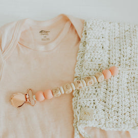 Handmade solid color personalized pacifier clip with silicone beads.