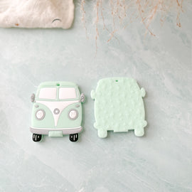front and back view of mint green vintage van silicone teether with flamingo textured bumps. 